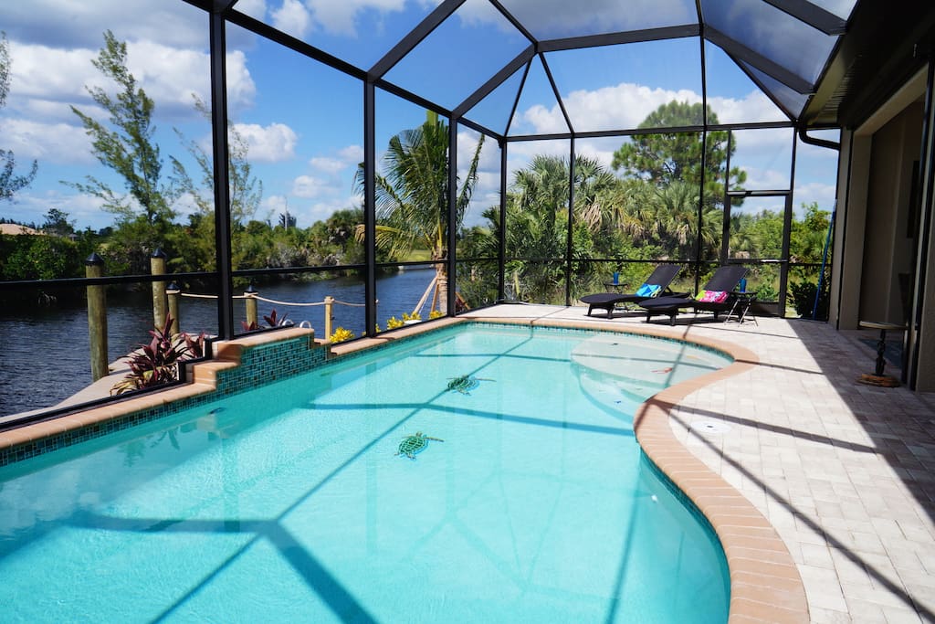 Pool with lounges and view at canal