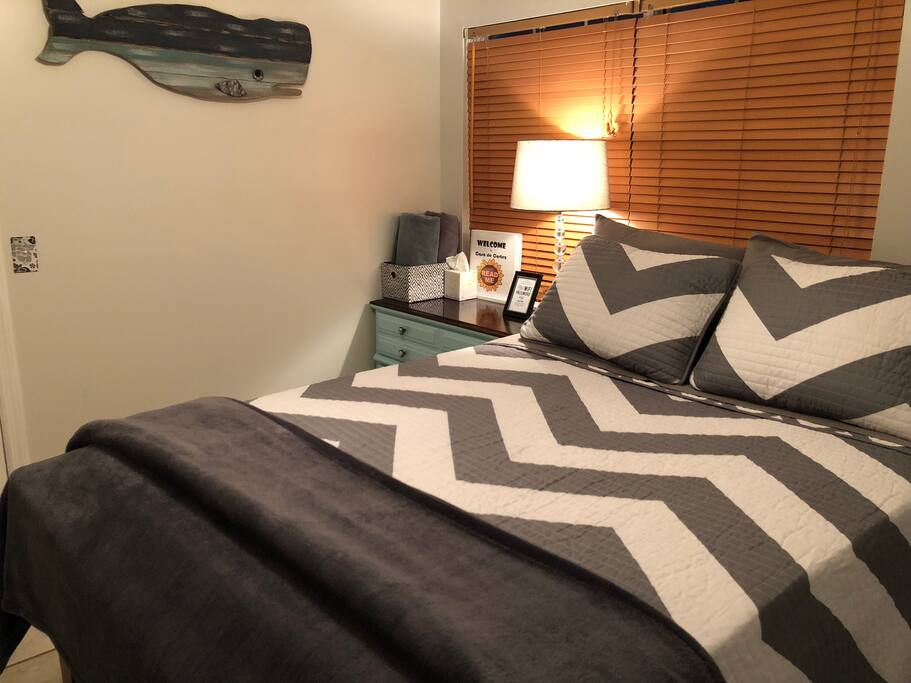 A comfortable full sized bed in a clean, relaxing room. The room comes with a dresser drawer for your things, overhead ceiling fan, private TV mounted on the wall, and some toiletries (toothbrush, shampoo, lotions, etc) in case you forget something.