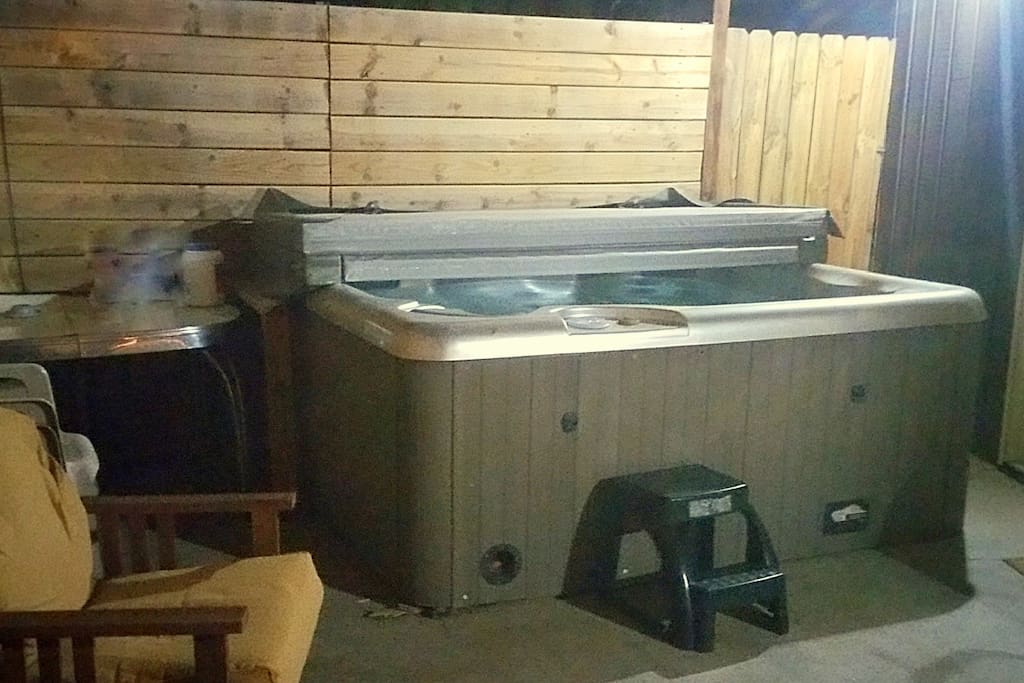 Enjoy the hot tub on a covered patio/courtyard.