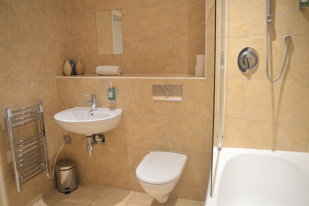 Spacious Bathroom with Shower over Bath