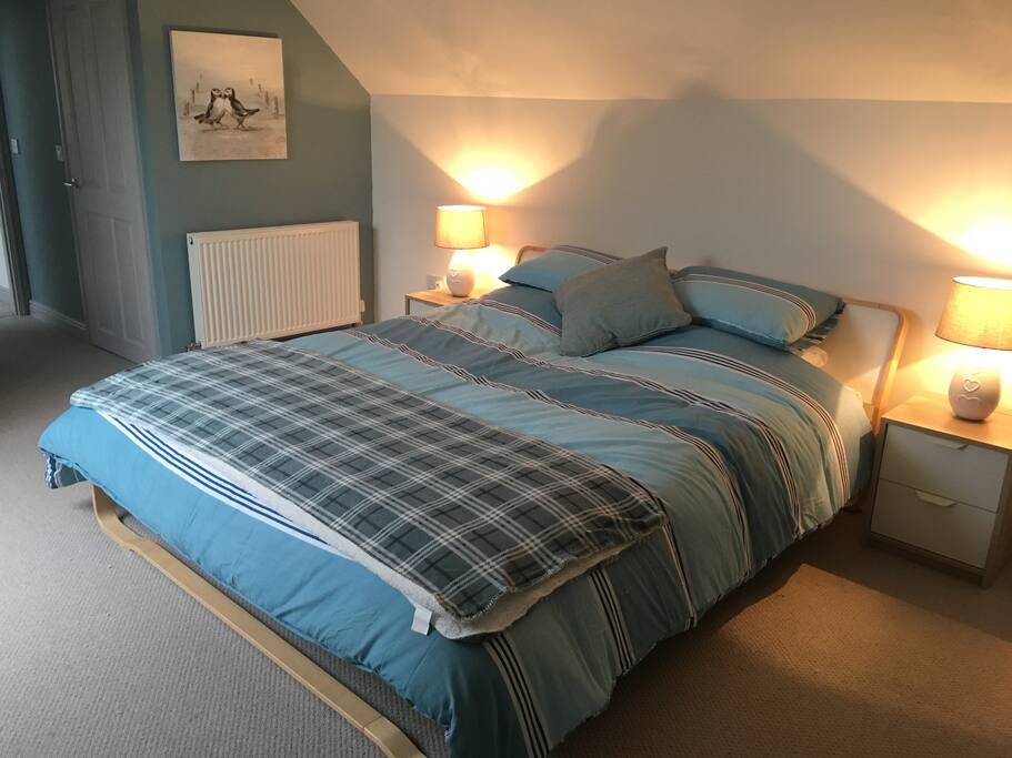 Master bedroom upstairs with super king size bed, 2x walk in wardrobes and huge on-suite.