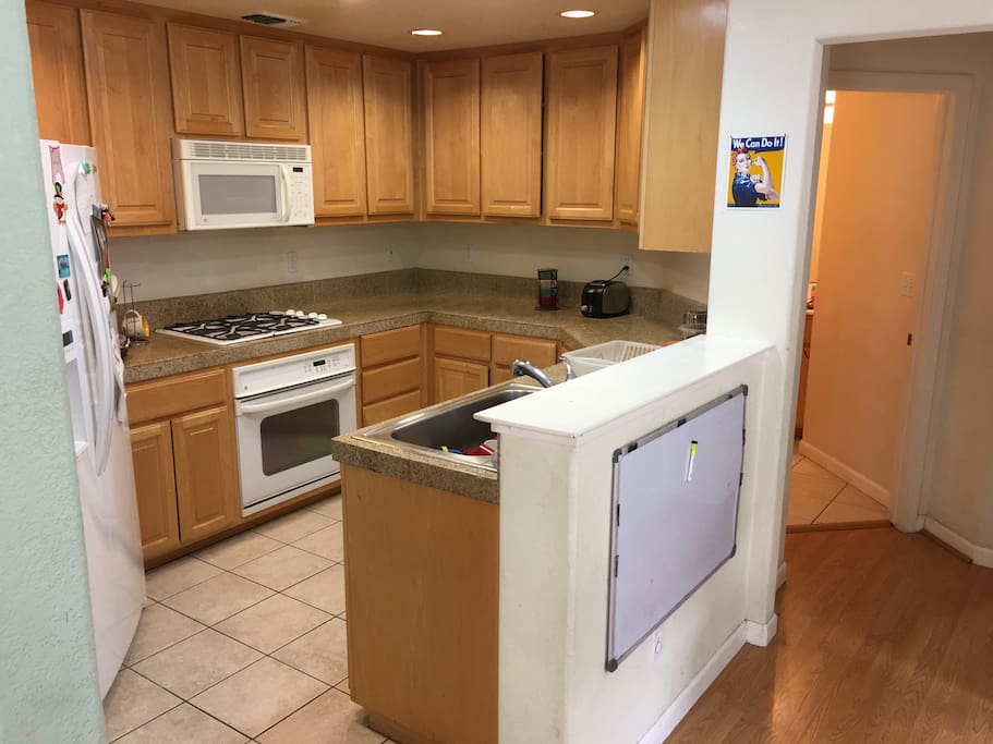 Kitchen with stove, oven and microwave.
