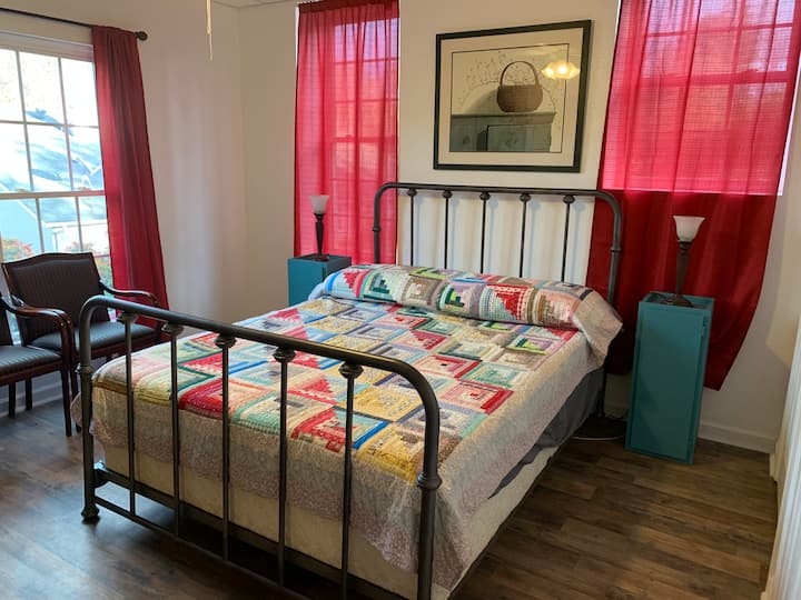 Queen bed in master bedroom.
