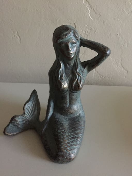 Mermaid statue.... our signature piece that greets you at the door