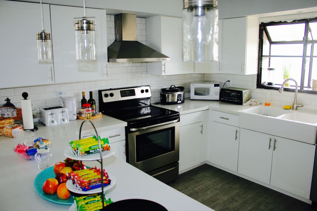Super spacious white modern kitchen. Awesome garden window with lots of natural sun light.