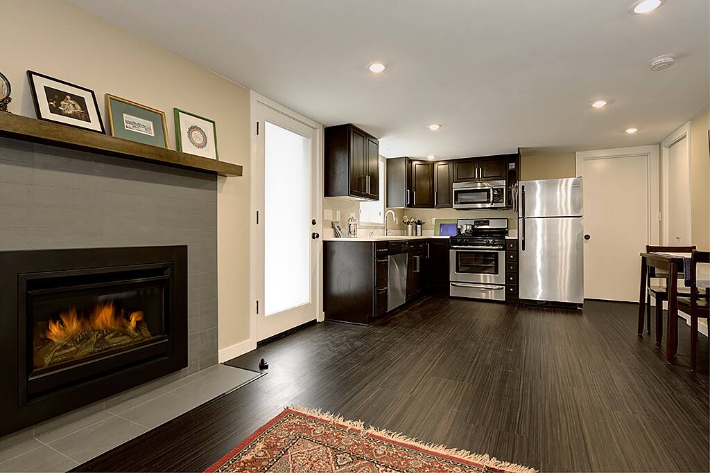 Open concept design with living room open to kitchen and dining room.