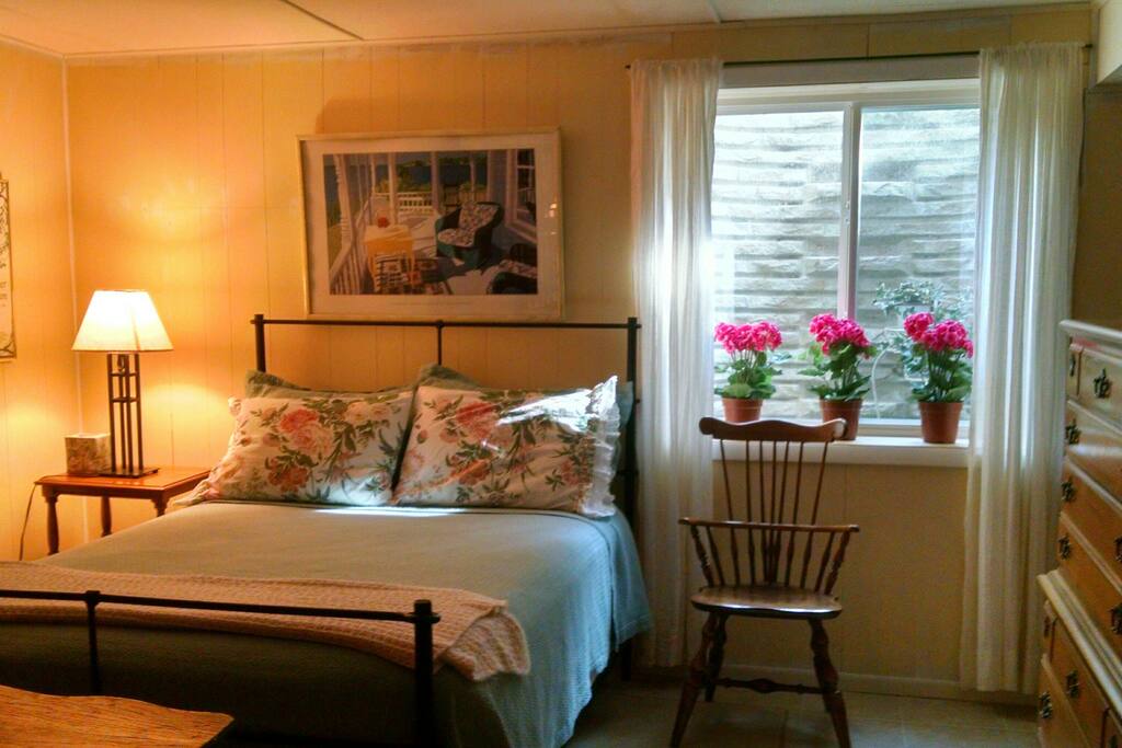 Bedroom with sunny egress window.