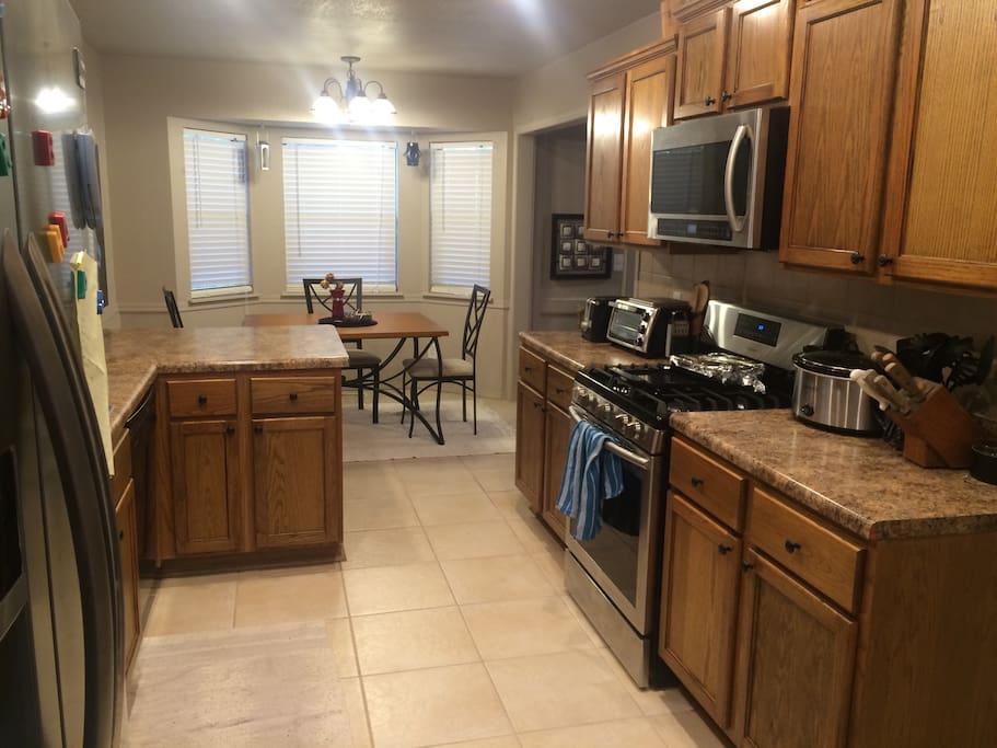 Fully functional kitchen with room in the fridge as well as a washer and dryer leading out to the garage