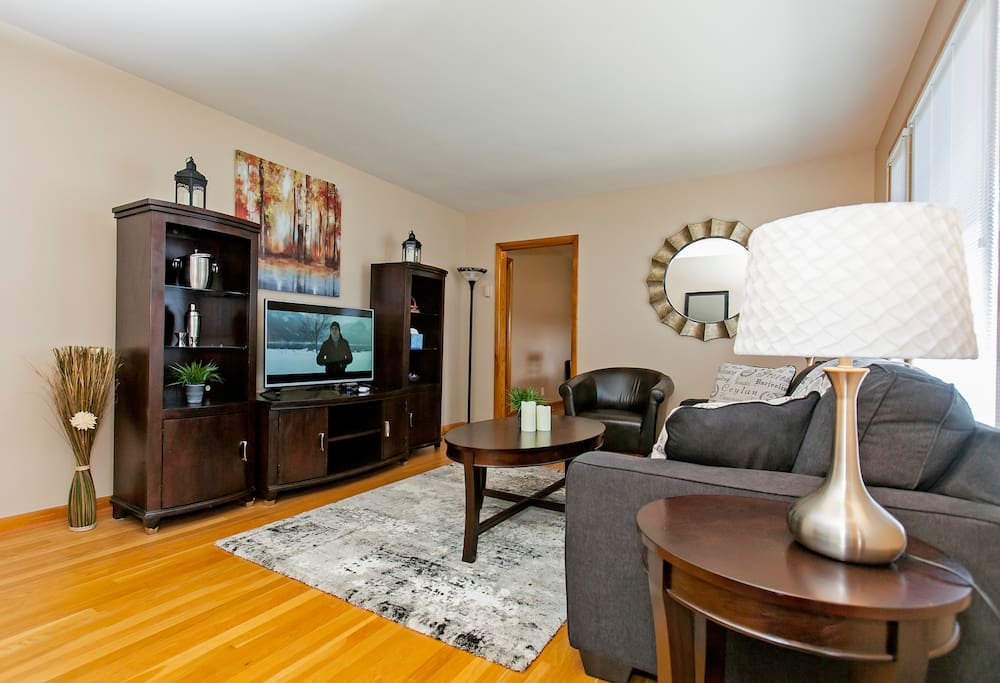 Living room with Queen sleeper sofa and Cable TV.