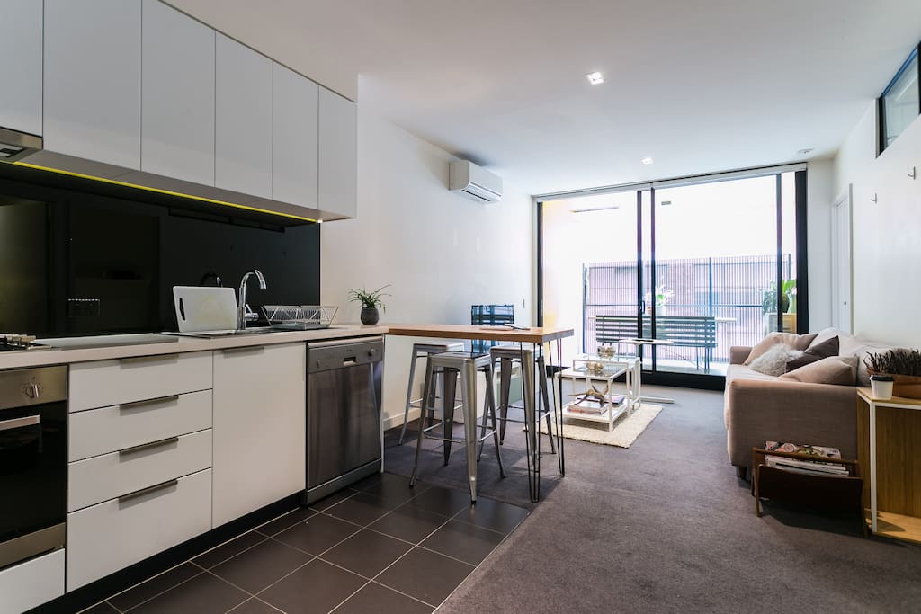 Open plan kitchen w dishwasher, microwave, gas oven/stovetop