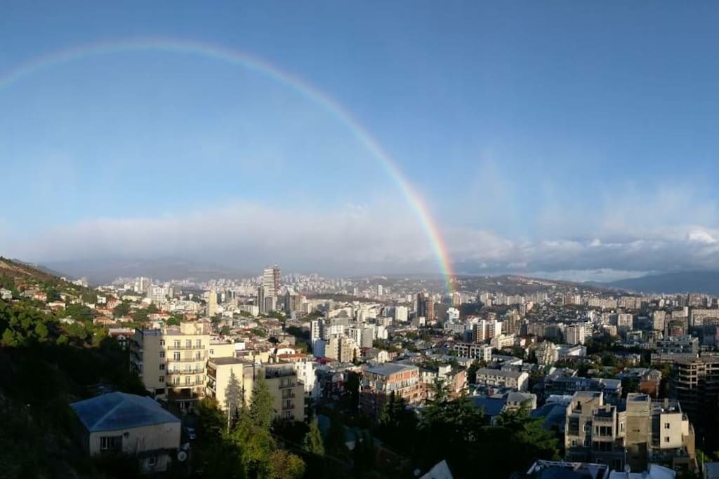 Watch double rainbow over the city!
