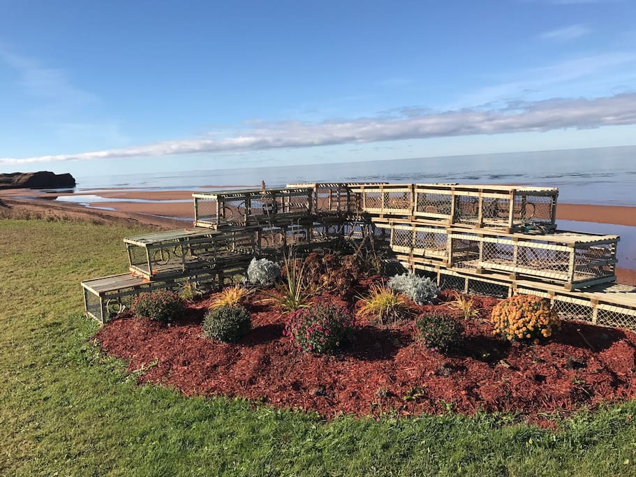 Beachfront lobster trap flower bed.