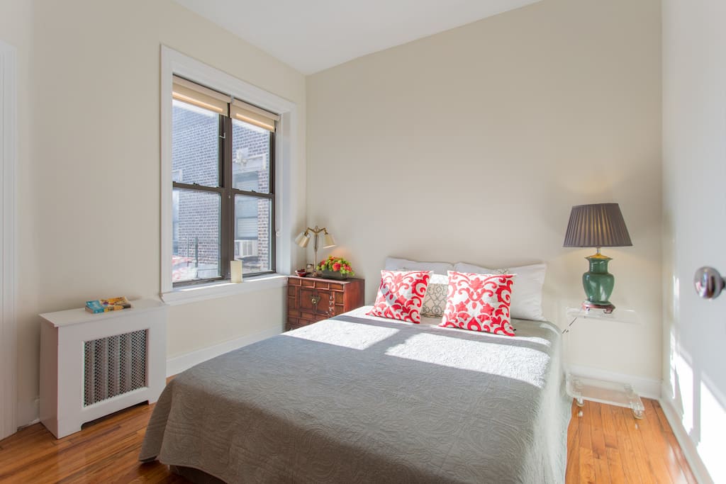 Your private bedroom with a private bathroom, views of Central Park, and plenty of light