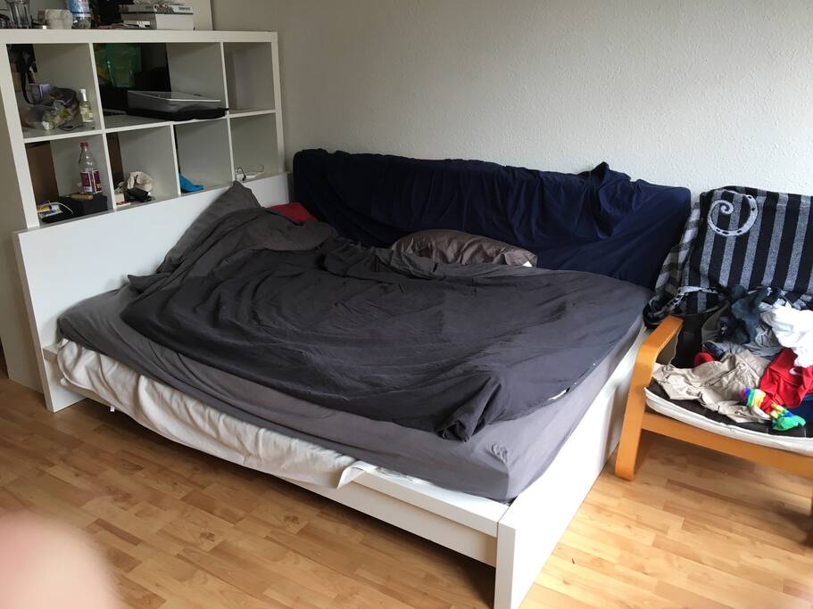 The bed, wardrobe and armchair