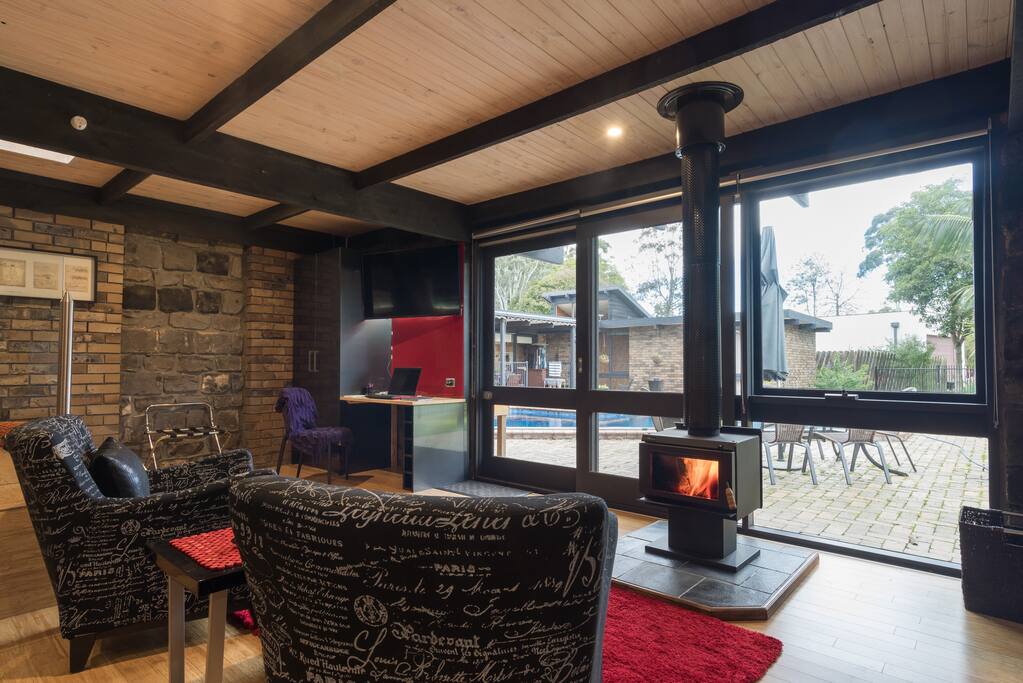 Overlook the pool in front of the fireplace for the comfort of your chair.