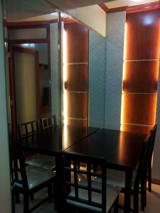 mirror walled dining area with back lights for romantic dining