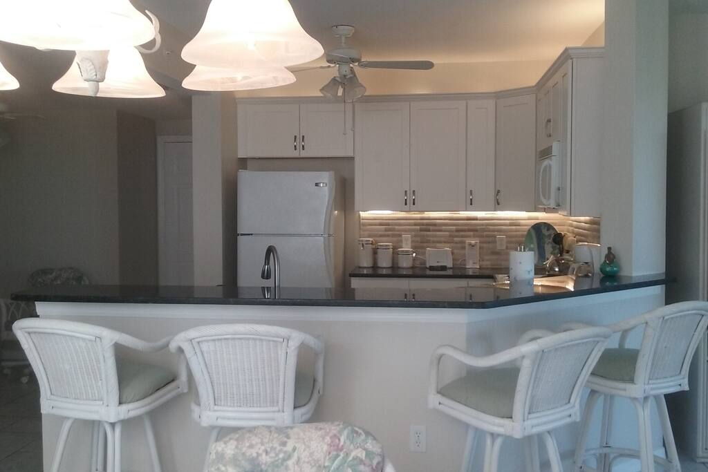 newly remodeled kitchen, new cabinets and granite counter top.