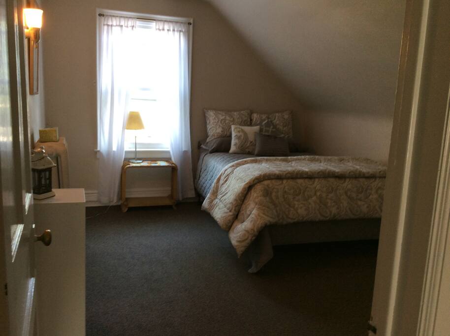 A cozy queen size bed and a view!