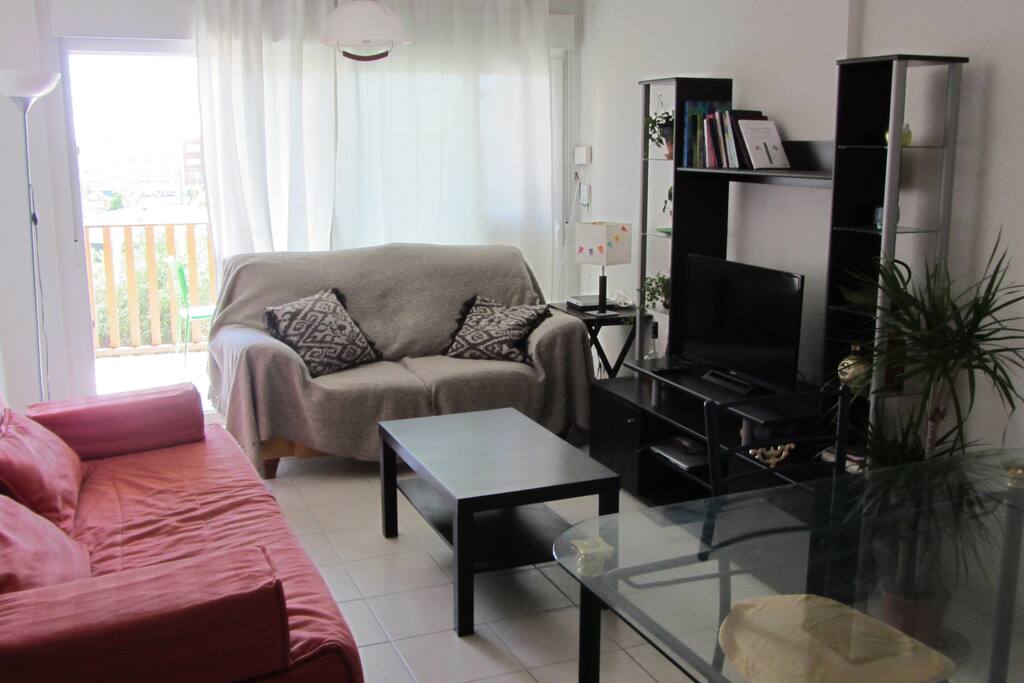 Living room with tv and balcony