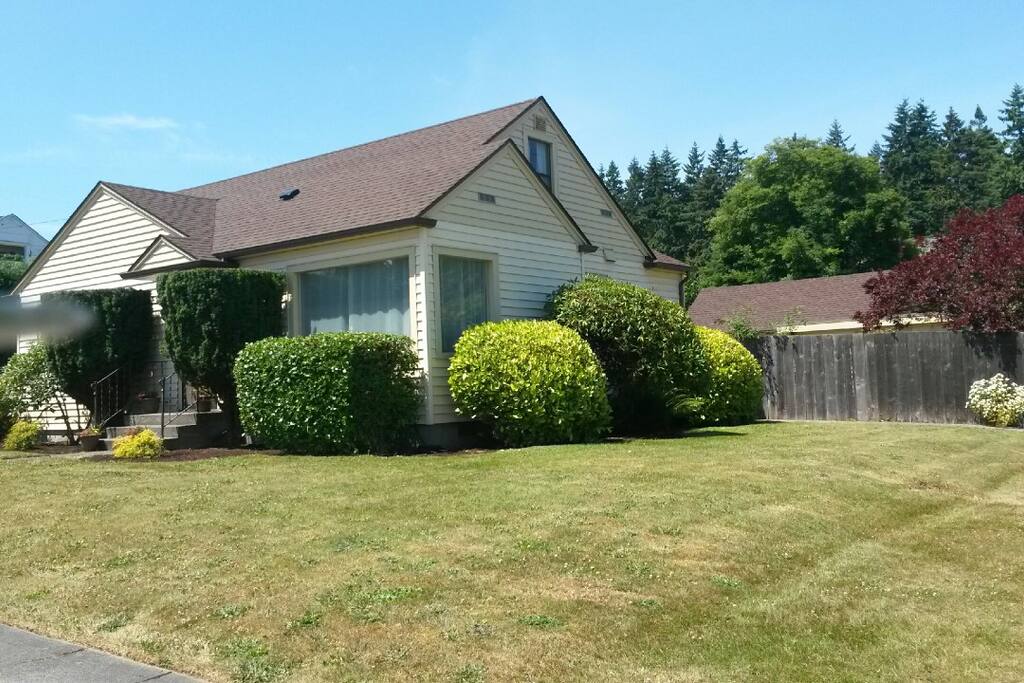 Street view of front of the house showing fenced back yard