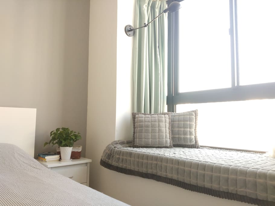 Large private bedroom with window bed