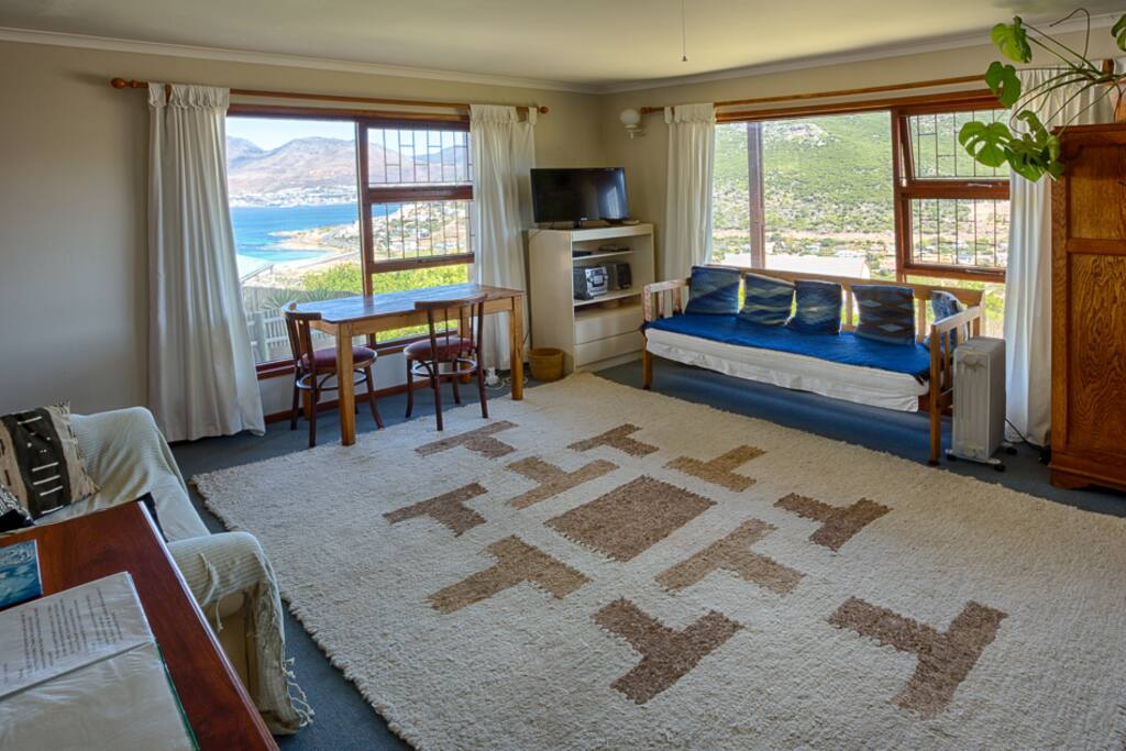 Lounge living space with great views of the ocean, valley and garden