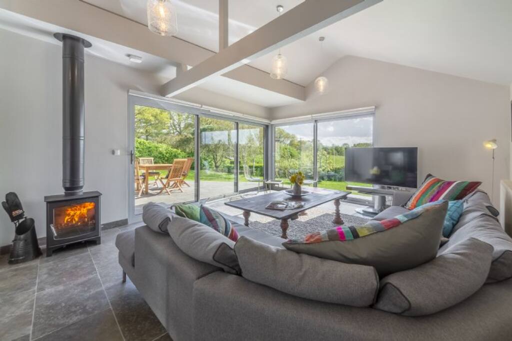 Open living space for all seasons, wood burning stove for cozy evenings.