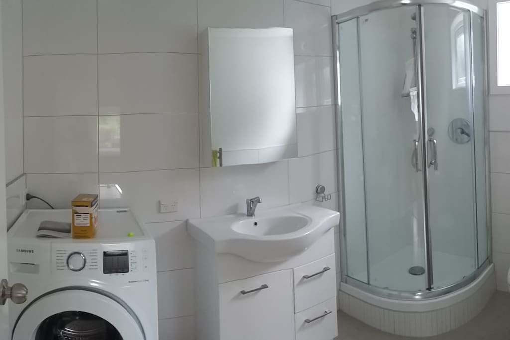 Fully tiled bathroom with Laundry