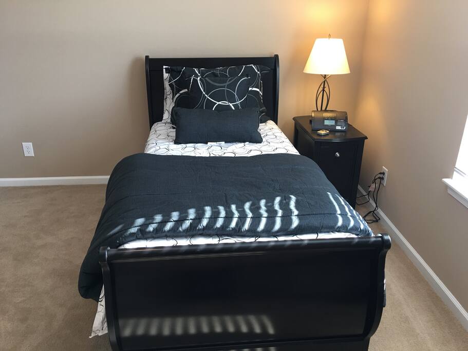 Bed with mattress and side lamp and docking music system