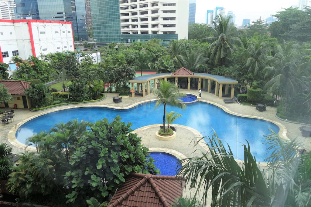 View from bedroom - guests have full access to pools, gym, tennis court, and restaurants
