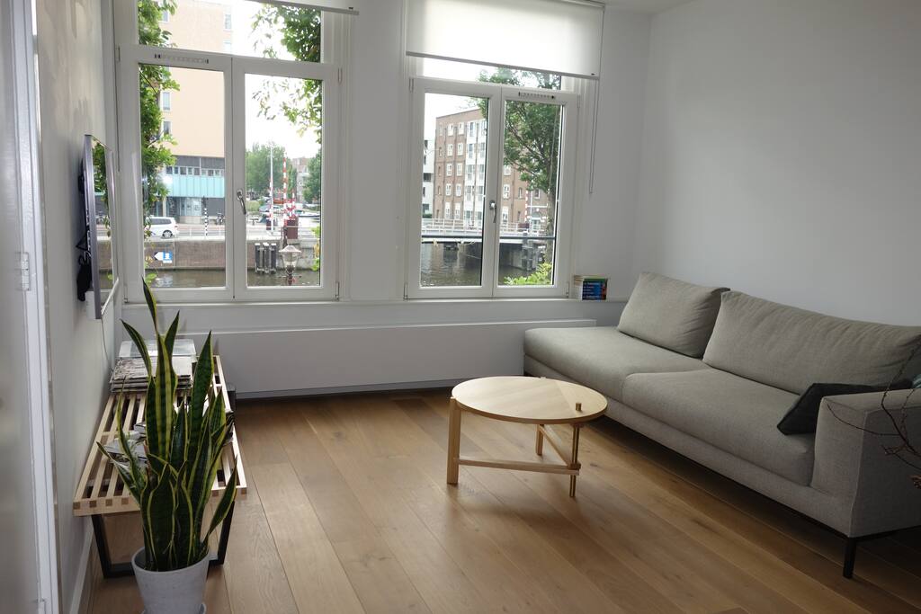 TV and sofa Area with canal views