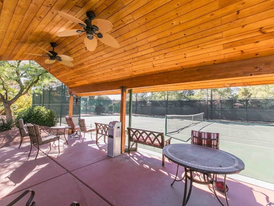 Tennis Courts with shaded socializing area.