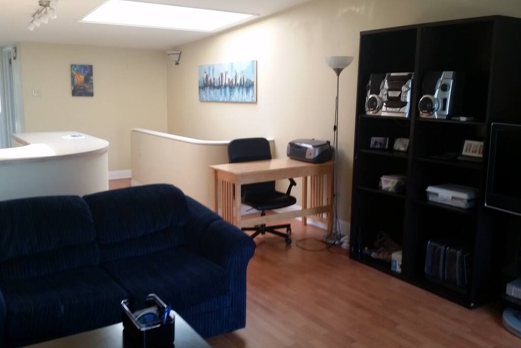 Open living room-kitchen area with desk