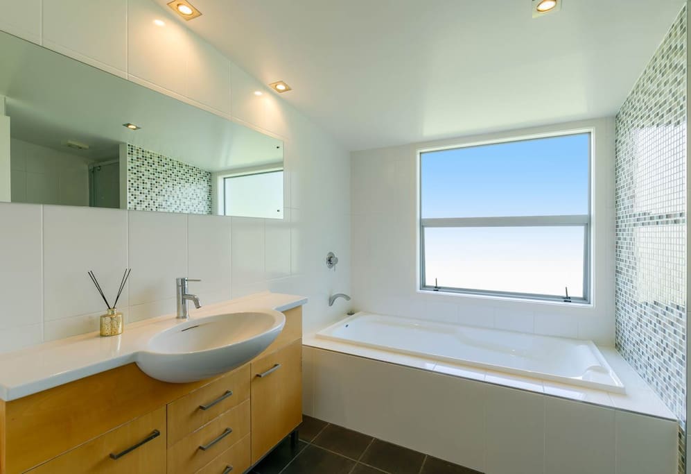 Shared bathroom with heated towel rail