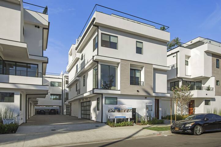 New modern luxury with panoramic rooftop deck