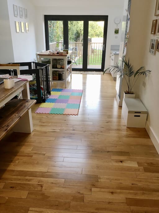 Dining area with kitchen round to the right. Kitchen island with seating for 2