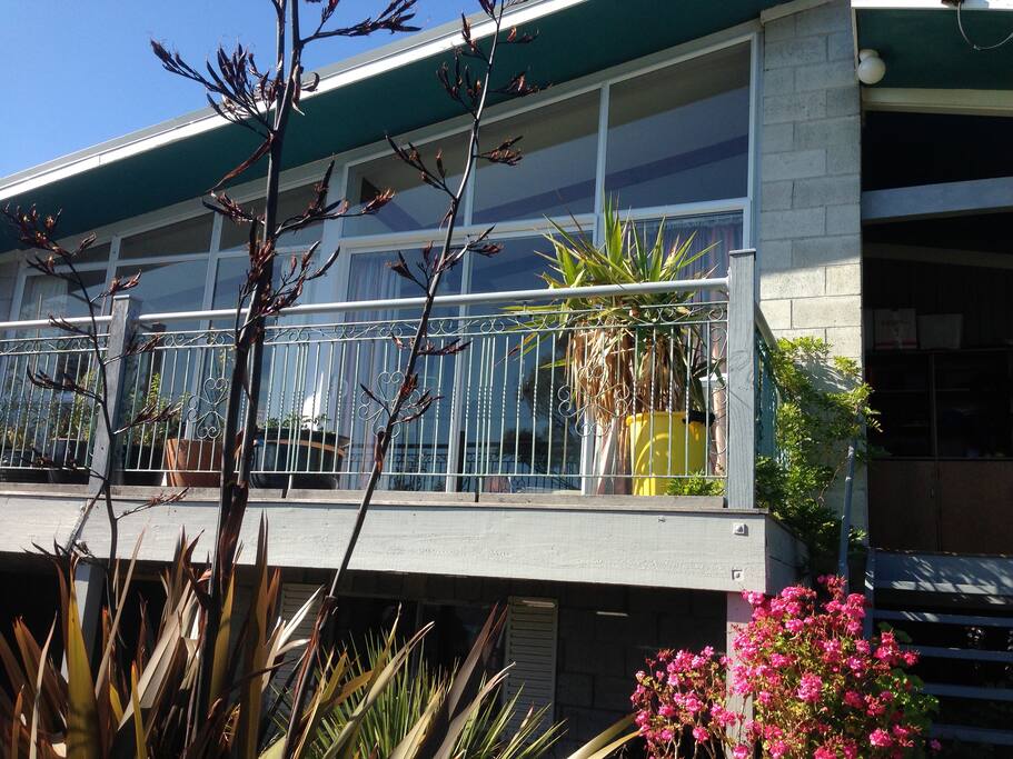 The front of the house is mostly glass