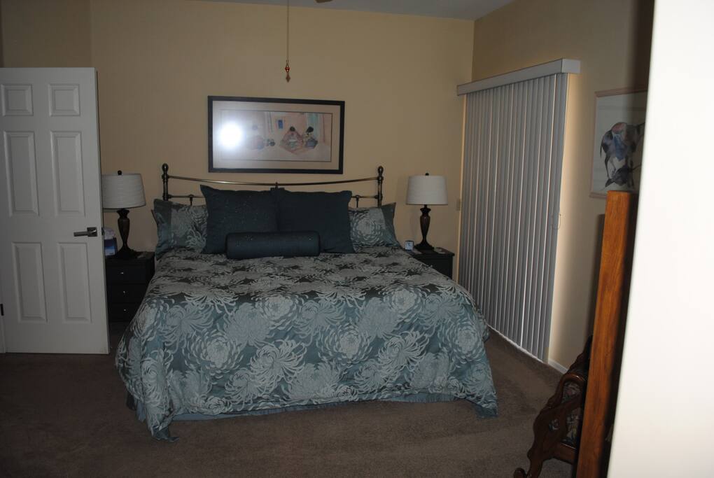 Another view of the bedroom with extremely comfortable memory foam/latex king-sized bed made by Phoenix's own Tuft and Needle.