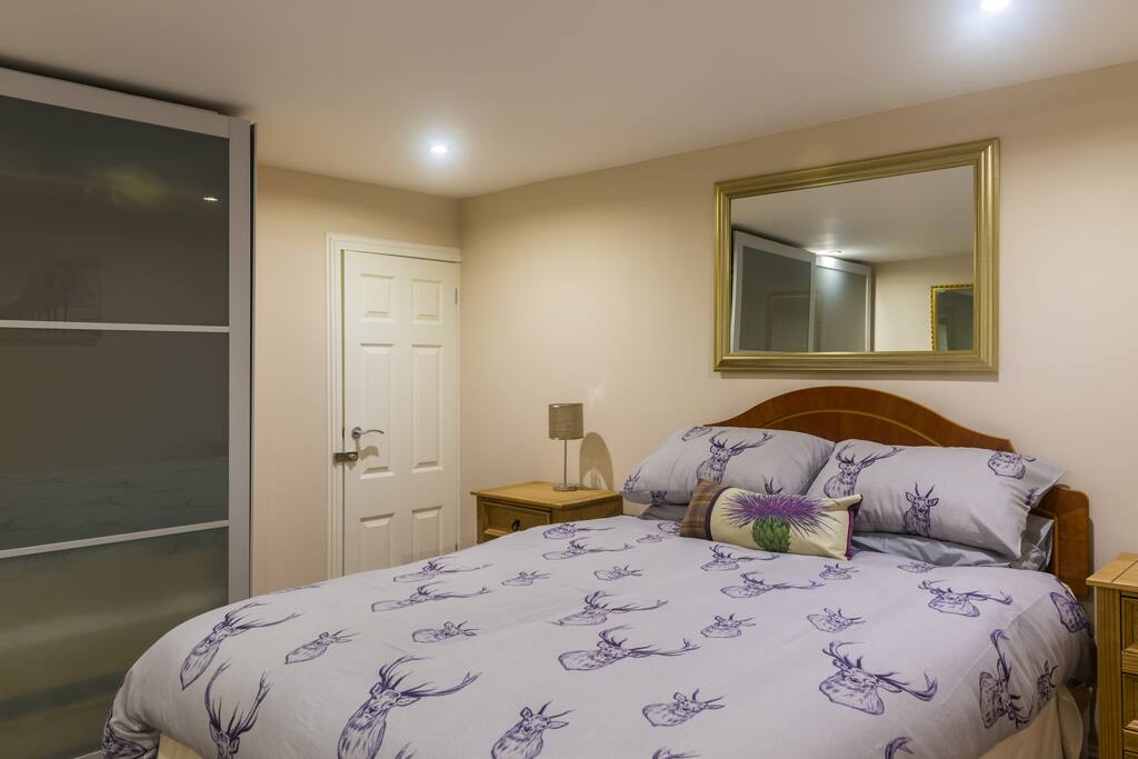 Bedroom with king size bed and double wardrobe