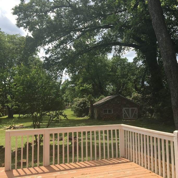 Gorgeous and spacious backyard with century old trees and a fire pit