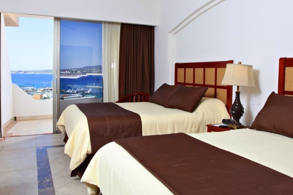The master bedroom is similar to this one but with an ocean view. 2 Double beds with en suite bathroom
