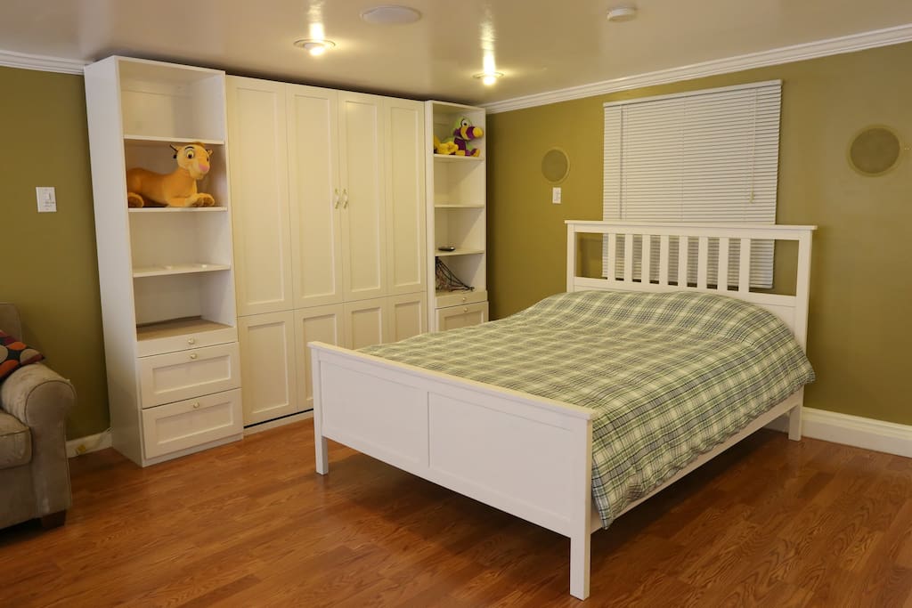 Queen size bed in large bedroom