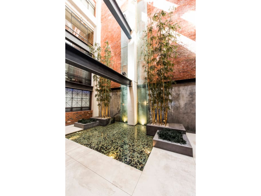 Foyer water fountain with relaxing sounds heard throughout building