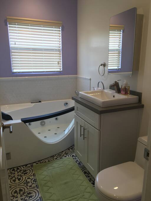 Luxury bathroom with clear tub.