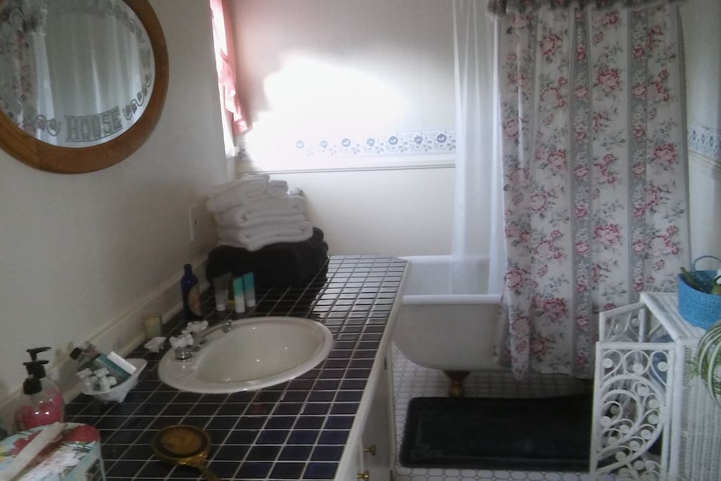 Upstairs bath, shared by two bedrooms. Both have a sink in the room.