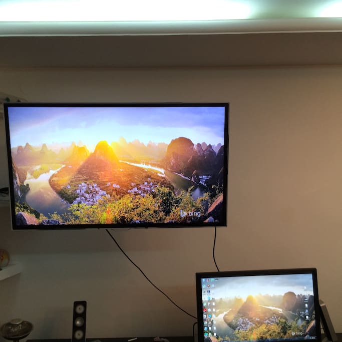 The TV can turn 90 degrees, to be watched from the couch OR the bed