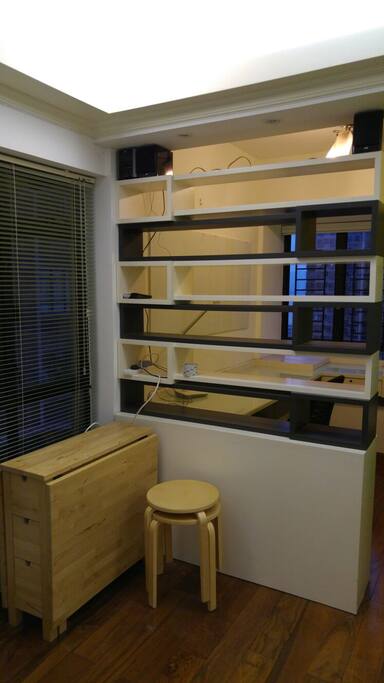 Living room with IKEA table, chairs and mini HiFi.