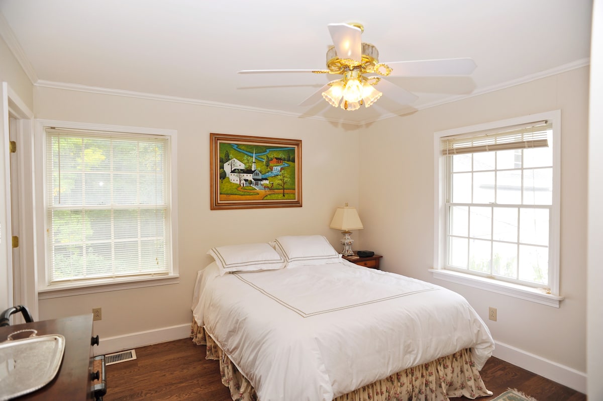 Bedroom with queen and view of river
