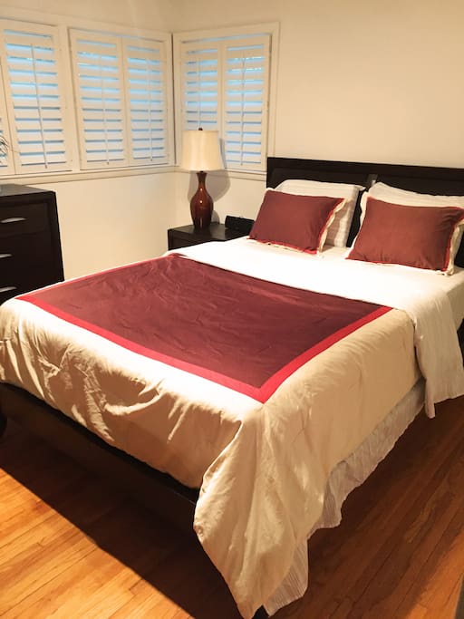 Queen-sized bed. New Hunter Douglas shutters throughout the main floor
