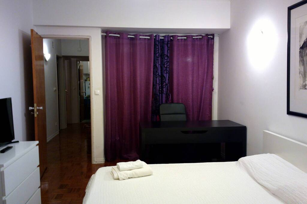 Suite with office desk and balcony